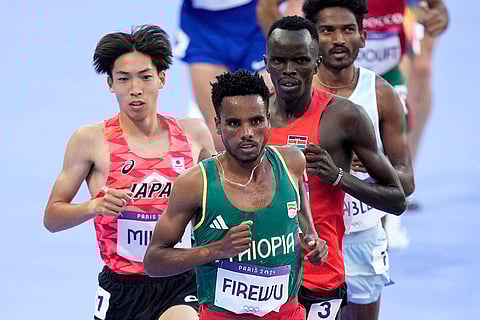 Samuel Firewu, Ryuji Miura, Abraham Kibiwot, and Avinash Mukund Sable compete in 3000 meters steeplechase